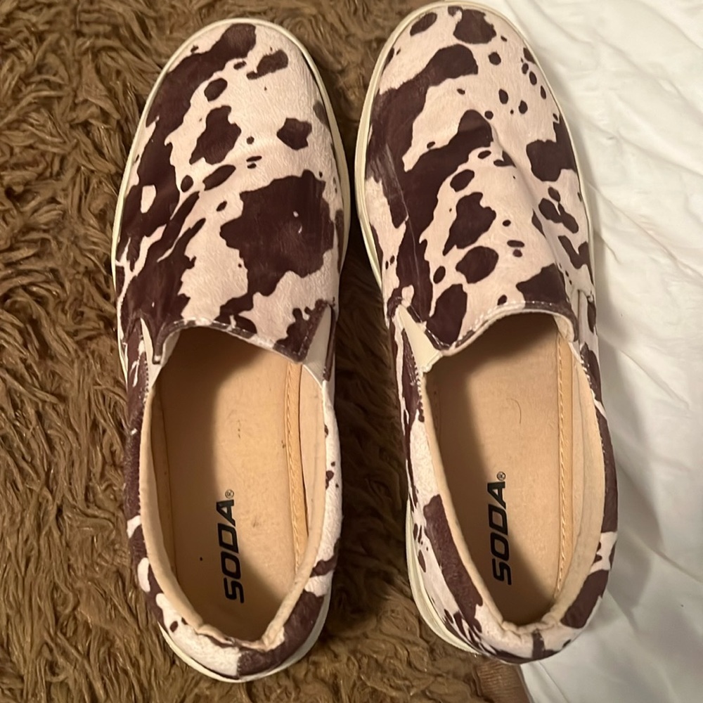 Cow print slip on sneakers